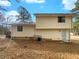 View of the home's backyard with siding and an outdoor space for relaxation at 10839 Mallard Dr, Jonesboro, GA 30238