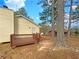 Backyard showing deck with railing and trees at 10839 Mallard Dr, Jonesboro, GA 30238