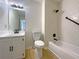 Clean bathroom featuring a shower-tub combo, tile flooring, and neutral-colored walls at 10839 Mallard Dr, Jonesboro, GA 30238