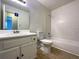 Functional bathroom features a single sink vanity and a shower-tub combination at 10839 Mallard Dr, Jonesboro, GA 30238