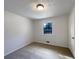 Cozy bedroom featuring neutral carpeting, a window, and ample natural light at 10839 Mallard Dr, Jonesboro, GA 30238