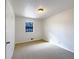 Comfortable bedroom featuring neutral carpeting, a window, and ample natural light at 10839 Mallard Dr, Jonesboro, GA 30238