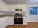 This modern kitchen features stainless steel appliances and generous cabinet space at 10839 Mallard Dr, Jonesboro, GA 30238