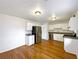 Bright kitchen featuring stainless steel appliances and plenty of white cabinet storage at 10839 Mallard Dr, Jonesboro, GA 30238