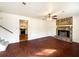 Living room features a stone fireplace, hardwood floors, and abundant natural light at 10839 Mallard Dr, Jonesboro, GA 30238