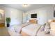 Bright main bedroom boasts carpeted floors and neutral walls, creating a tranquil retreat at 10839 Mallard Dr, Jonesboro, GA 30238