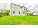 Back exterior of the house with a large, green backyard at 142 Henley St, Canton, GA 30114