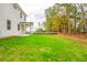 Exterior of the house featuring a covered patio and large backyard at 142 Henley St, Canton, GA 30114
