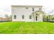 Back exterior of the house with a large yard at 142 Henley St, Canton, GA 30114