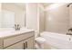 Bright bathroom with a large vanity, white cabinets, and a tiled shower-over-tub combination at 142 Henley St, Canton, GA 30114