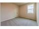 Carpeted bedroom with a large window for natural light at 142 Henley St, Canton, GA 30114