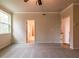 Cozy bedroom with carpet, natural light from windows, and access to ensuite bathroom at 142 Henley St, Canton, GA 30114