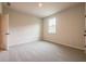 Bright bedroom featuring carpet, window and white trim at 142 Henley St, Canton, GA 30114