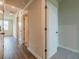Hallway with hardwood floors and white doors at 142 Henley St, Canton, GA 30114