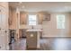 Well-lit kitchen with stainless steel appliances, gray cabinets, and an open-concept design at 142 Henley St, Canton, GA 30114