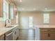 Contemporary kitchen features stainless steel appliances, an island, and a door to the backyard at 142 Henley St, Canton, GA 30114
