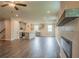 Open-concept living room and kitchen with hardwood floors and neutral color scheme at 142 Henley St, Canton, GA 30114