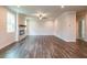 Spacious living room with wood floors, recessed lighting, fireplace, and lots of natural light at 142 Henley St, Canton, GA 30114