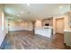 An open concept living space with wood floors and a kitchen with a center island at 142 Henley St, Canton, GA 30114