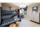 Stylish bedroom with a bunk bed, modern dresser, and a dedicated desk area, great for children at 264 Rockledge Sw Bnd, Powder Springs, GA 30127