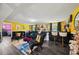 Finished basement featuring a bar, lounge area, and eye-catching yellow paint at 3087 Sanibel Sw Dr, Stone Mountain, GA 30087