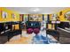 Basement lounge space with a decorative rug, bar, and a comfortable seating area at 3087 Sanibel Sw Dr, Stone Mountain, GA 30087