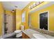 Bright bathroom featuring a granite countertop vanity and a tile shower with a black trim and shelving at 3087 Sanibel Sw Dr, Stone Mountain, GA 30087