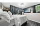 Bedroom with white bedding, decorative curtains, and stylish decor at 3087 Sanibel Sw Dr, Stone Mountain, GA 30087