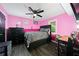 Pink bedroom with a black accent and leopard print bedding, great natural light at 3087 Sanibel Sw Dr, Stone Mountain, GA 30087