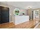 Entryway featuring wood floors, art window, and paneled half-wall at 3087 Sanibel Sw Dr, Stone Mountain, GA 30087