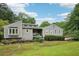 Beautiful exterior view with a well kept lawn and landscaped garden at 3087 Sanibel Sw Dr, Stone Mountain, GA 30087
