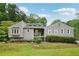 Charming single-Gathering home featuring a well-manicured lawn and a classic, inviting facade at 3087 Sanibel Sw Dr, Stone Mountain, GA 30087