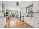 Modern kitchen with white cabinets, stainless steel appliances, and a window seat at 3087 Sanibel Sw Dr, Stone Mountain, GA 30087