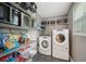 A pantry featuring shelving and washer and dryer at 3087 Sanibel Sw Dr, Stone Mountain, GA 30087