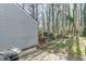 Backyard featuring a barbecue grill and wooded views at 6606 Wellington Sq, Norcross, GA 30093