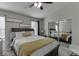 Inviting bedroom featuring carpeted floors, mirror sliding closet doors, and a ceiling fan at 6606 Wellington Sq, Norcross, GA 30093