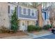 Charming two-story townhome featuring a cozy front yard with lovely landscaping and assigned parking at 6606 Wellington Sq, Norcross, GA 30093