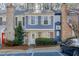 Charming two-story townhome featuring a cozy front yard with lovely landscaping and assigned parking at 6606 Wellington Sq, Norcross, GA 30093