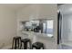 Well-lit kitchen featuring modern stainless steel appliances, white cabinets, and granite countertops at 6606 Wellington Sq, Norcross, GA 30093