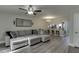 Spacious living room features modern flooring and a large sectional sofa with accent pillows at 6606 Wellington Sq, Norcross, GA 30093