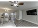 Open-concept living room showcases modern flooring and a breakfast bar overlooking the kitchen at 6606 Wellington Sq, Norcross, GA 30093