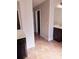 Bathroom with double sinks, dark cabinets, large mirror, and tile floor at 2622 Glenbrook, Loganville, GA 30012