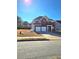 Charming two-story home with a brick facade, double garage, and well-maintained front yard at 2622 Glenbrook, Loganville, GA 30012