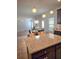 Open concept kitchen featuring granite counters and pendant lights at 2622 Glenbrook, Loganville, GA 30012