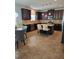 Spacious kitchen features dark wood cabinets, granite countertops, and stainless steel appliances at 2622 Glenbrook, Loganville, GA 30012
