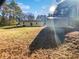 View of backyard with accessory building, house and ample outdoor space at 3103 Mote Rd, Covington, GA 30016