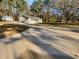 Home exterior with long driveway and an accessory building in a wooded surrounding at 3103 Mote Rd, Covington, GA 30016