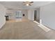 An empty living room with new carpet and attached kitchen and dining area at 3103 Mote Rd, Covington, GA 30016