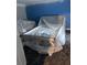 Bedroom showcases a bed frame covered in plastic, in need of new flooring at 457 Rockborough Ter, Stone Mountain, GA 30083