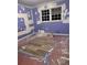 Bedroom showcasing a window and newly installed laminate flooring awaiting final touches at 457 Rockborough Ter, Stone Mountain, GA 30083